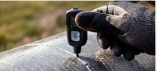 Coating thickness gauge on a coated steel pipe